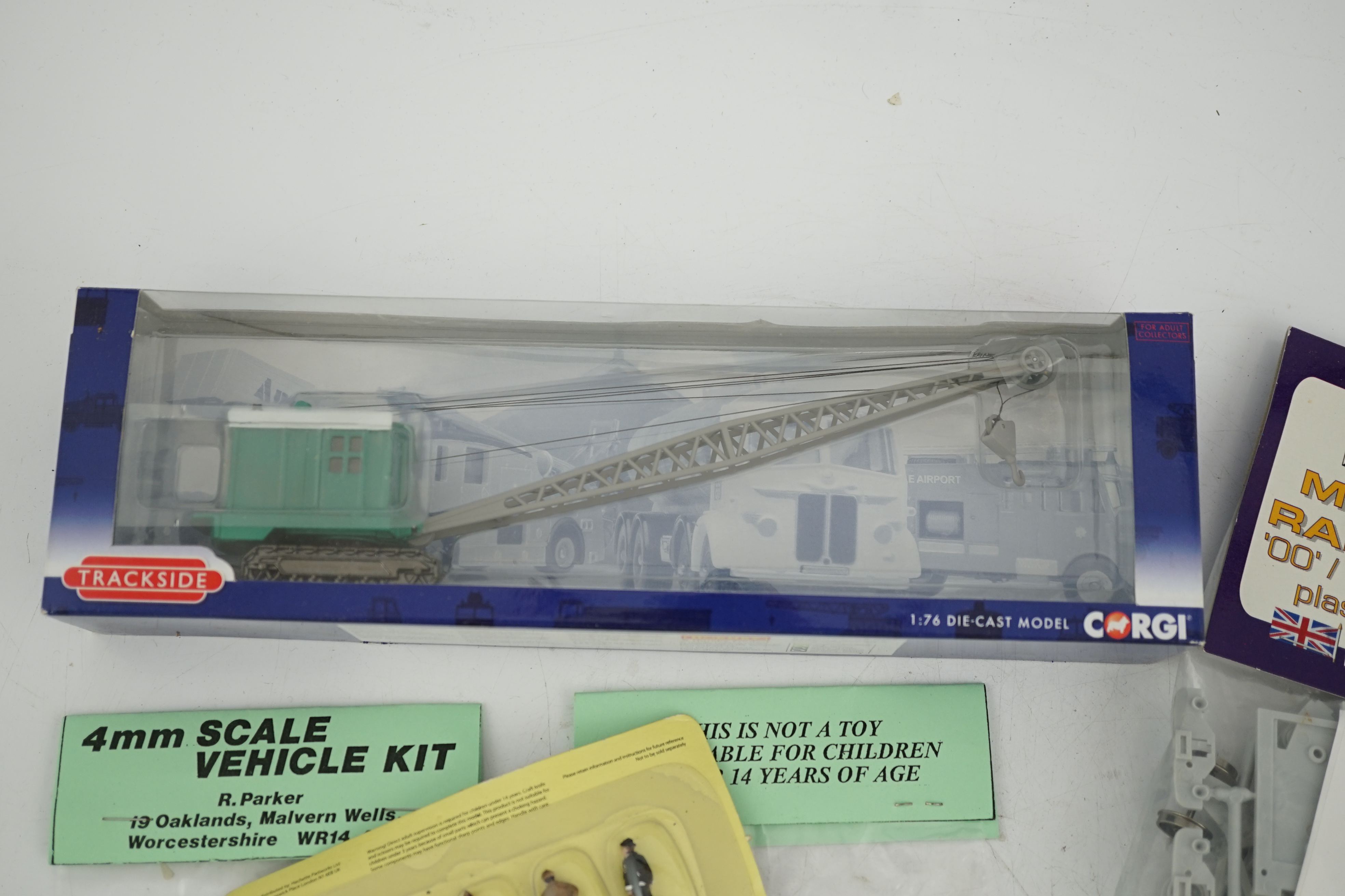 A collection of packeted white metal and plastic 00 gauge model railway kits by Dapol, 4mm Scale Vehicle kits R. Parker, etc. including diesel cranes, AEC lorries, LBSCR Stroudley 4-wheel coaches, trackside vehicles, etc